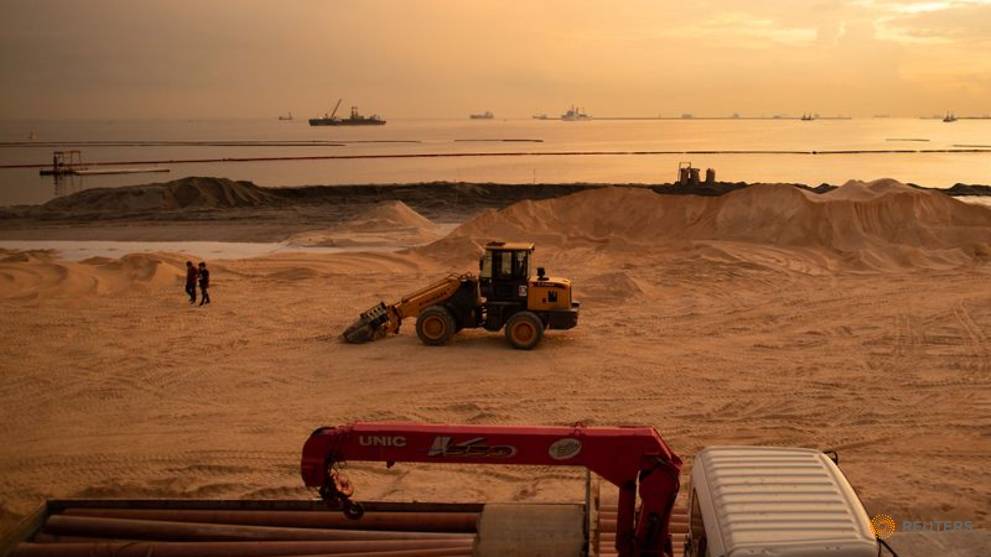 Polluted stretch of Manila Bay gets fake white sand makeover