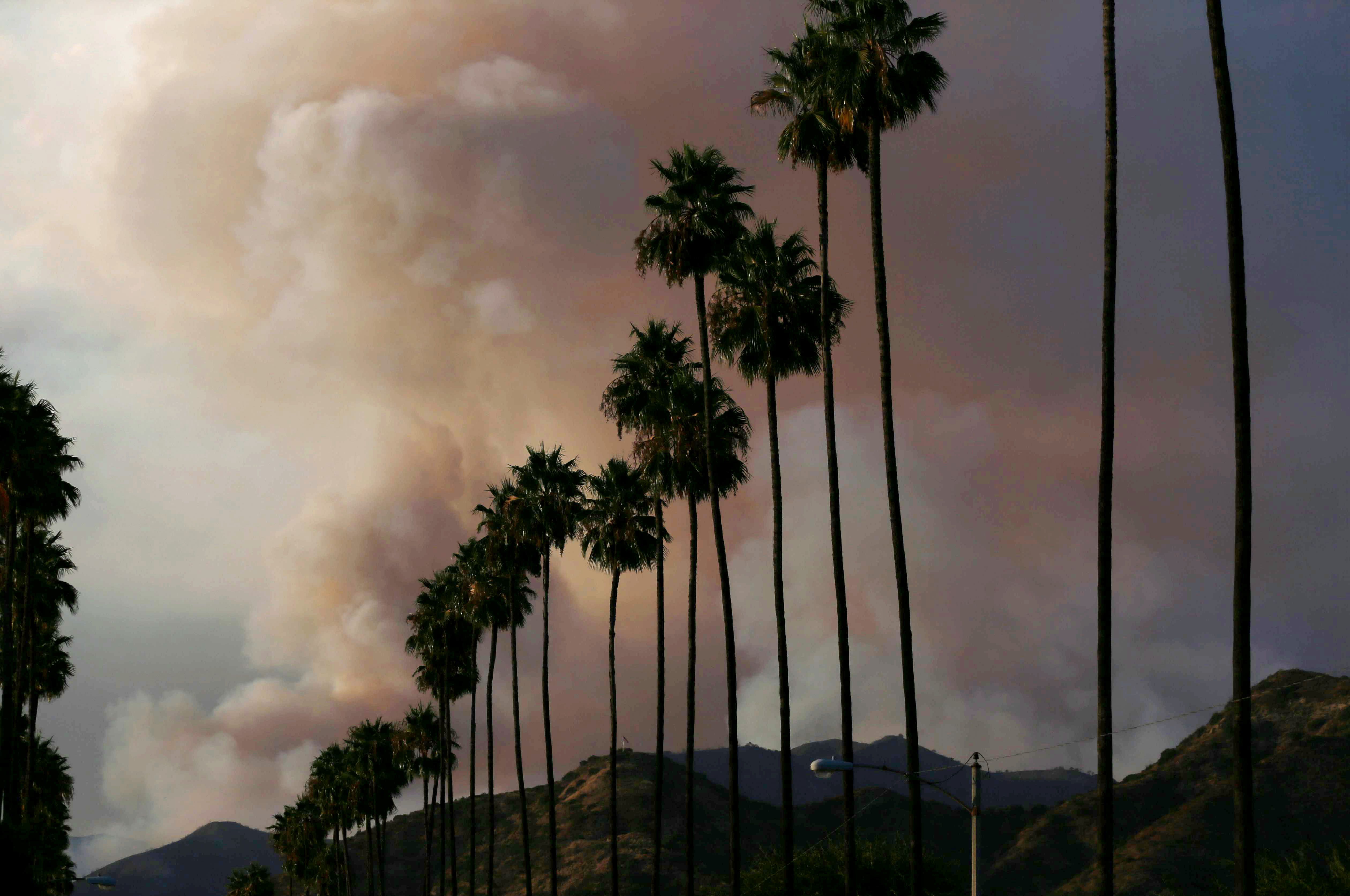 California declares state of emergency as it fights fires, extreme weather