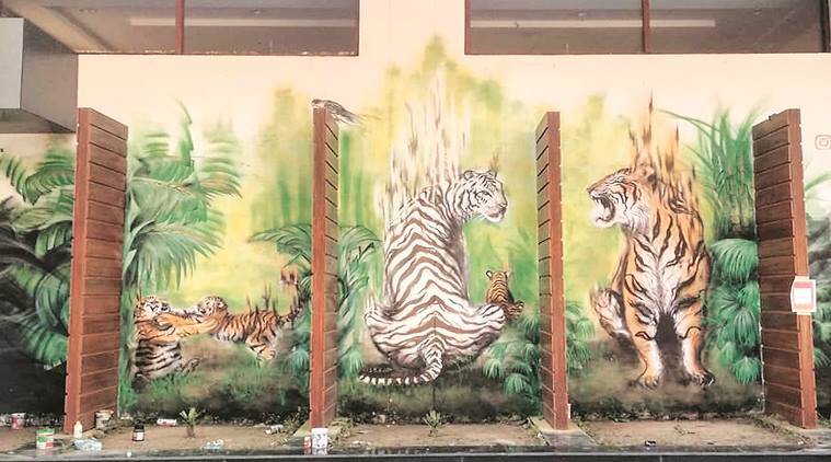 Mural depicting big cat family, including newly arrived three cubs, welcomes visitors in a Chandigarh zoo