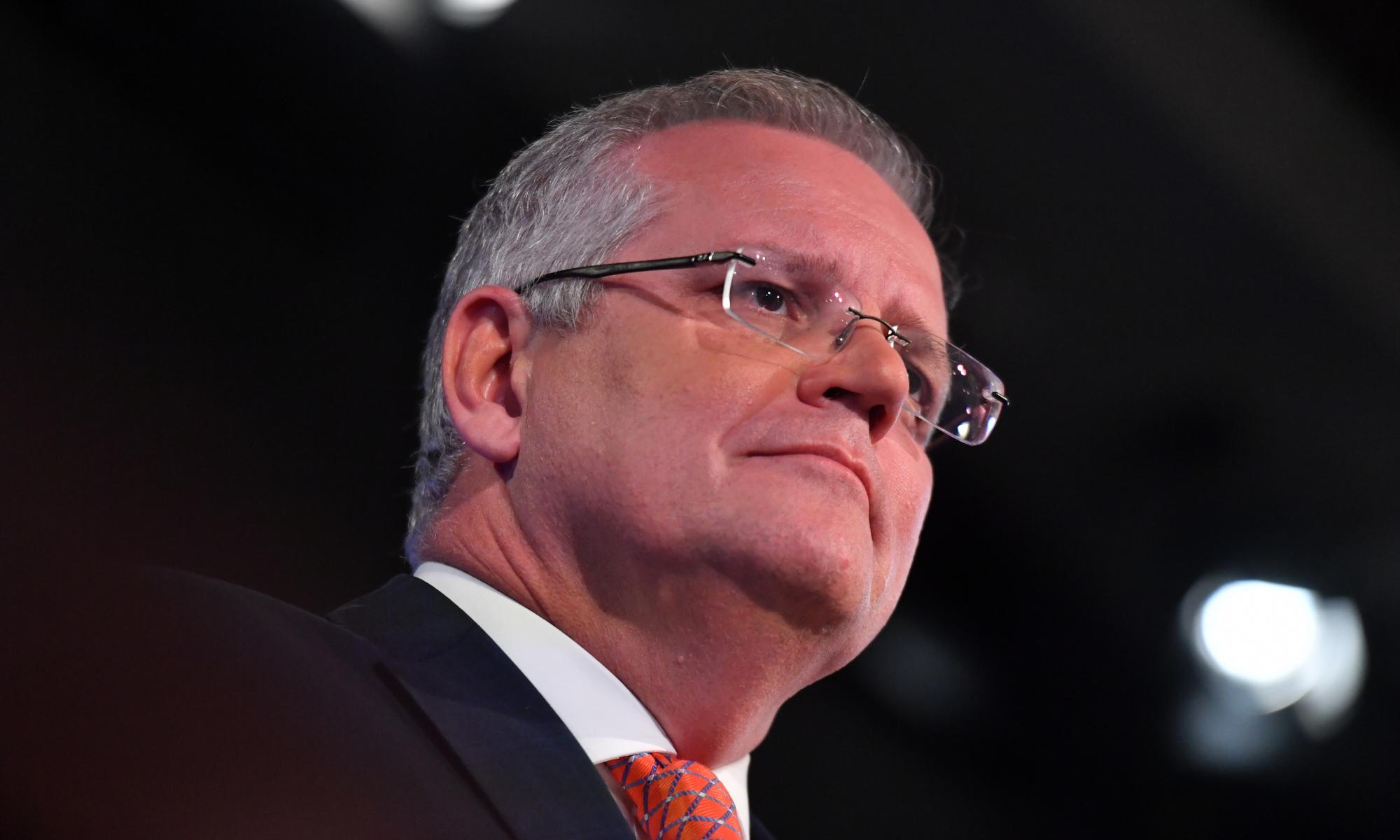 Australia already 'carrying its load' on emissions and must adapt to warmer climate, PM says