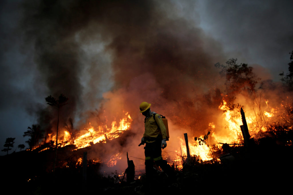 Climate change is driving wildfires, giving 'rocket fuel' to tropical storms