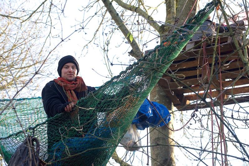 Protesters climb trees to protect UK woodland from planned rail link