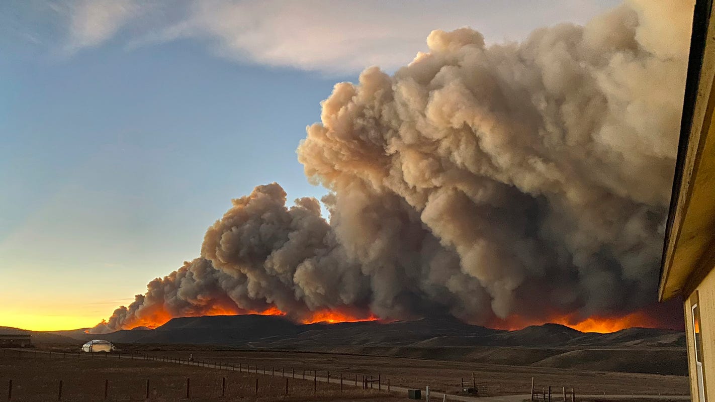 Photos show orange skies, towering smoke over Colorado wildfires as concerns mount over air quality